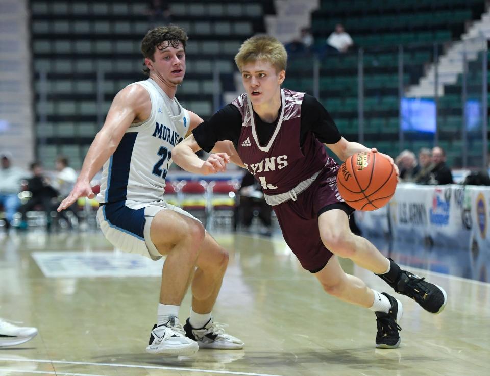 Lyons' Mike Briggs, right, drives to the basket against Moravia's Kyler Proper during a NYSPHSAA Class C Boys Basketball Championships semifinal in Glens Falls, N.Y., Friday, March 15, 2024. Lyons’ season ended with a 56-45 loss to Moravia-IV.