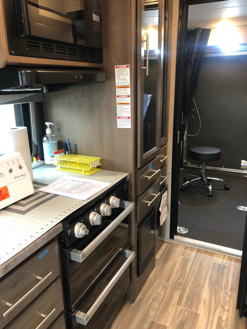 The mobile clinic has a fridge, a bathroom, a lab section, running water, televisions for educational materials, a waiting room and other amenities.