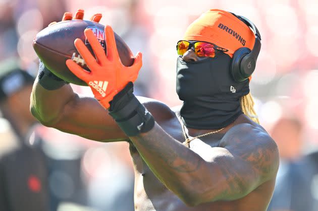 During warmups, the 27-year-old kept his face under wraps with a black balaclava and a pair of sunglasses.