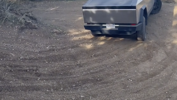 a car parked on a dirt road