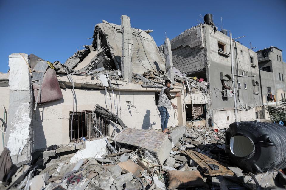People search through buildings, destroyed during Israeli raids a day earlier, in the southern Gaza Strip on Nov. 17, 2023 in Khan Yunis, Gaza.