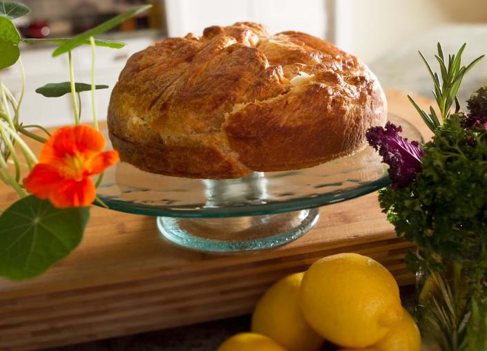 A traditional Argentinian torta pascualina, filled with spinach and ricotta and wrapped in puff pastry, makes a rustic yet regal addition to any spring brunch.