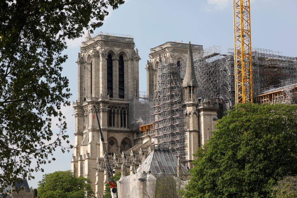 A view shows the Notre-Dame de Paris Cathedral, which was damaged in a devastating fire one year ago, as the coronavirus disease (COVID-19) lockdown slows down its restoration in Paris, France, April 11, 2020. (REUTERS/Charles Platiau)