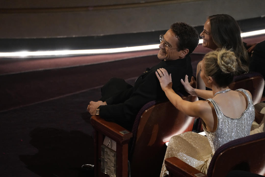 Robert Downey Jr., left, and Emily Blunt appear in the audience during the Oscars on Sunday, March 10, 2024, at the Dolby Theatre in Los Angeles. (AP Photo/Chris Pizzello)