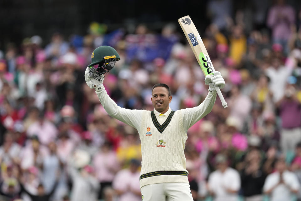 Australia's Usman Khawaja celebrates making 100 runs against South Africa during the second day of their cricket test match at the Sydney Cricket Ground in Sydney, Thursday, Jan. 5, 2023. (AP Photo/Rick Rycroft)