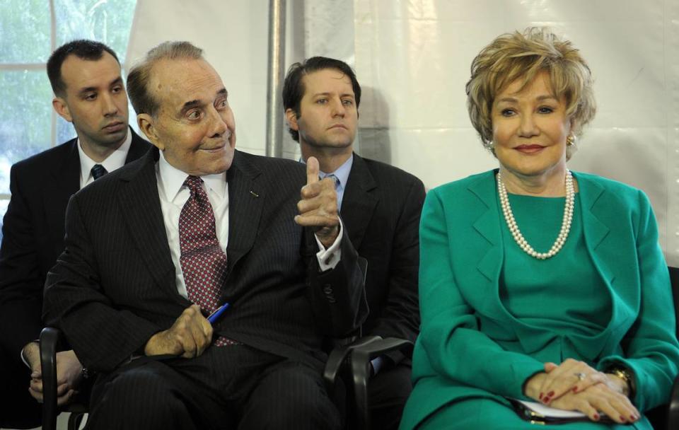 Former Sen. Bob Dole, a World War II veteran, left, with his wife, Elizabeth attend an Interior Department ceremony to dedicate a plaque honoring him at the World War II Memorial.