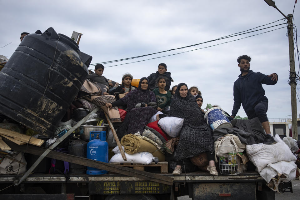 Palestinians arrive in the southern Gaza town of Rafah after fleeing an Israeli ground and air offensive in the nearby city of Khan Younis on Friday, Jan. 26, 2024. Israel has expanded its offensive in Khan Younis, saying the city is a stronghold of the Hamas militant group. (AP Photo/Fatima Shbair)