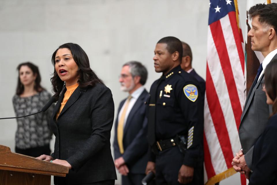San Francisco Mayor London Breed (L) speaks during a press conference as San Francisco police chief William Scott (R) looks on at San Francisco City Hall on March 16, 2020 in San Francisco, California. San Francisco Mayor London Breed announced a shelter in place order for residents in San Francisco until April 7. The order will allow people to leave their homes to do essential tasks such as grocery shopping and pet walking. 