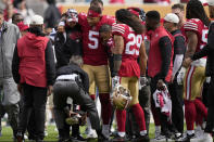 San Francisco 49ers quarterback Trey Lance (5) is helped onto a cart during the first half of an NFL football game against the Seattle Seahawks in Santa Clara, Calif., Sunday, Sept. 18, 2022. (AP Photo/Tony Avelar)