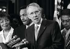 Minority Leader Sen. Harry Reid, D-Nev., center, answers questions at a news conference with members of the Congressional Black Caucus Thursday in Washington, D.C. AP photo