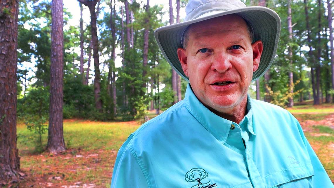 Arborist George Barker talks about the need to prioritize trees growing in communities and soil health at Carver Park in August 2024.