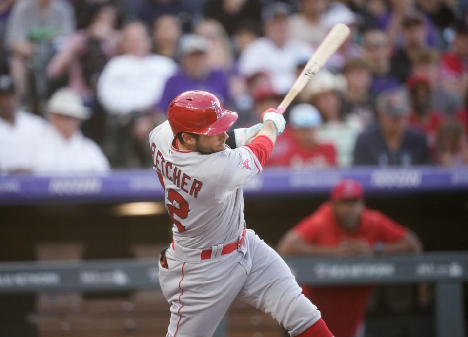 Angels' David Fletcher follows up on a two-run single against Rockies starting pitcher Chase Anderson