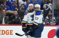 St. Louis Blues center Ryan O'Reilly, left, celebrates a goal against the Colorado Avalanche with David Perron during the first period in Game 1 of an NHL hockey Stanley Cup second-round playoff series Tuesday, May 17, 2022, in Denver. (AP Photo/Jack Dempsey)