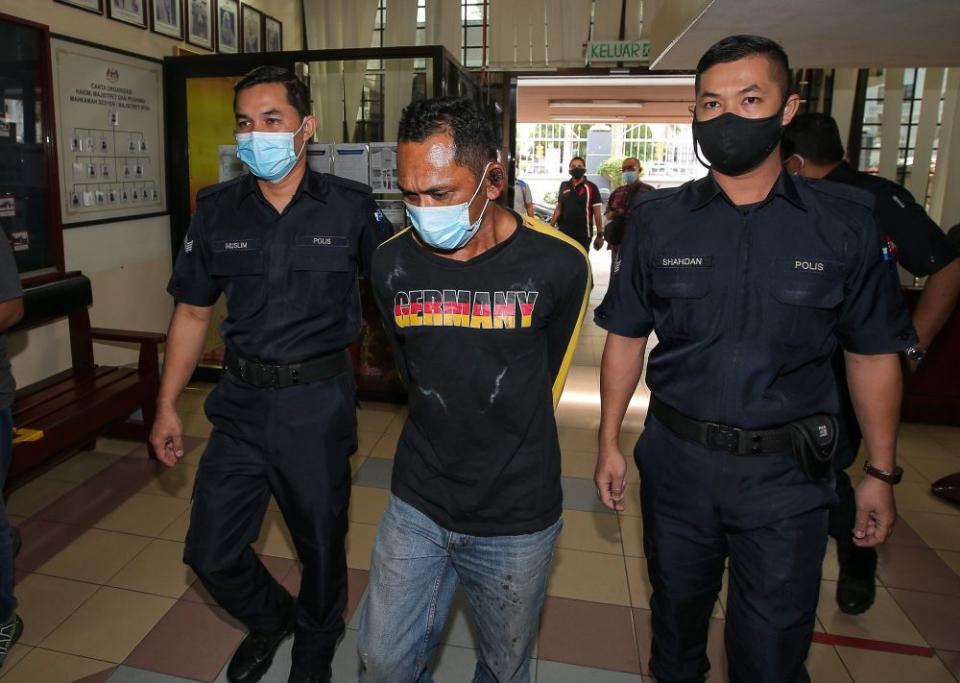 Scrap metal worker Arnee Ahamad Pazir claimed trial at the Magistrate’s Court in Ipoh to causing riot and damage to the Lahat police station here and also injuring a policeman in the process on January 24, 2021. — Picture by Farhan Najib