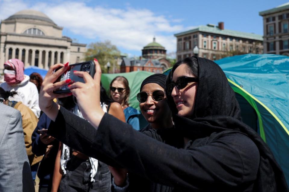Omar took selfies with students while on campus. REUTERS