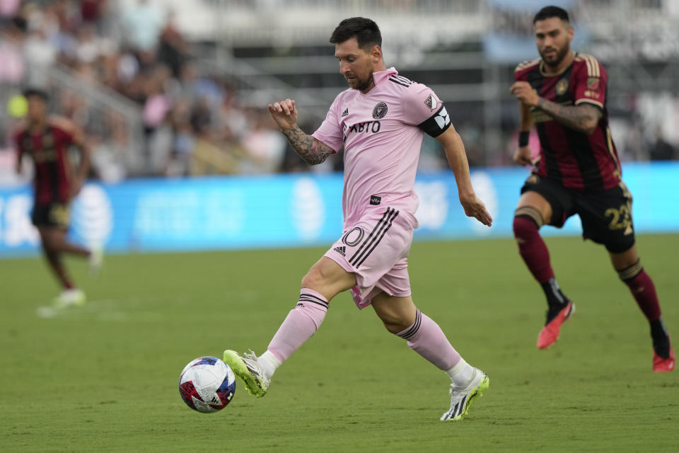 FILE - Inter Miami forward Lionel Messi (10) runs with the ball during the first half of a Leagues Cup soccer match against Atlanta United, Tuesday, July 25, 2023, in Fort Lauderdale, Fla. (AP Photo/Lynne Sladky, File)