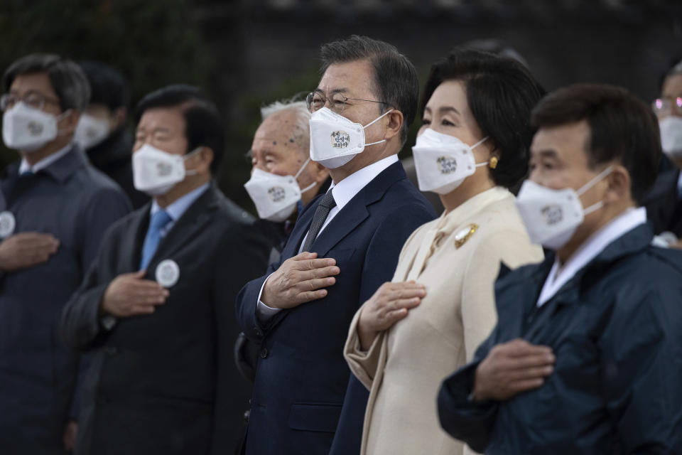 South Korean President Moon Jae-in, third right, and his wife Kim Jung-sook, second right, attend at a ceremony to mark the 102nd anniversary of the March First Independence Movement Day, the anniversary of the 1919 uprising against Japanese colonial rule in Seoul, South Korea, Monday, March 1, 2021. (Jewon Heon-kyun/Pool Photo via AP)