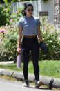 <p>Lucy Hale takes a solo walk in Los Angeles on Friday.</p>