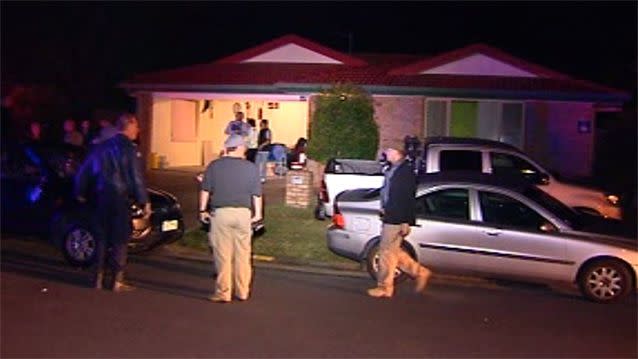 About 60 people swarmed the Varsity Lakes street as motorbike helmets were thrown at house windows. Photo: 7News