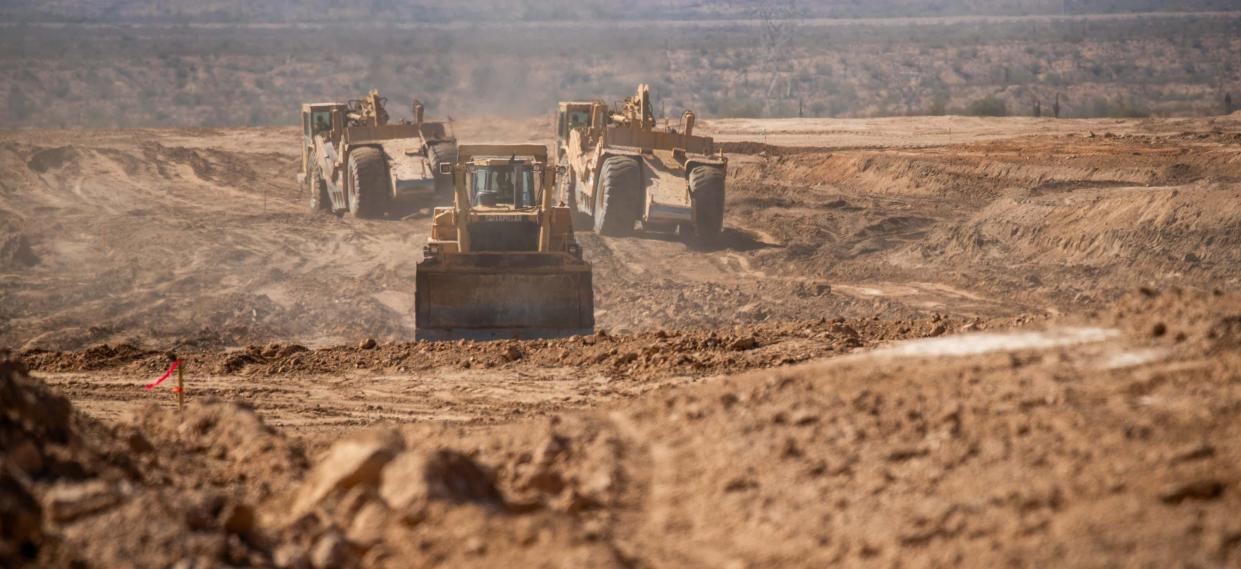 Construction vehicles at the construction site of Teravalis, a premier master planned community, in Buckeye on Oct. 5, 2023.