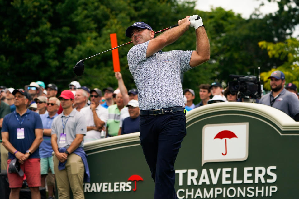 FILE - Ryan Armour watches his shot on the first hole during the second round of the Travelers Championship golf tournament at TPC River Highlands, Friday, June 24, 2022, in Cromwell, Conn. Armour was supposed to be out with a rib injury until late October. But he recovered in time to earn back his PGA Tour card and opens the season on Thursday, Sept. 15, 2022. (AP Photo/Seth Wenig, File)