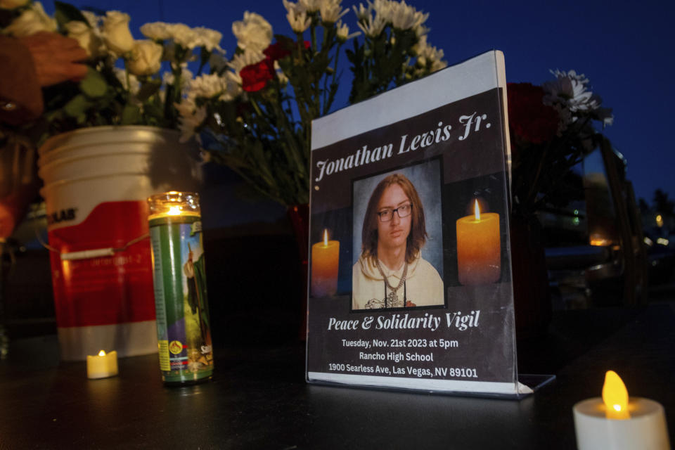 A memorial for Jonathan Lewis Jr. is set up in an alleyway near Rancho High School in eastern Las Vegas, on Tuesday, Nov. 21, 2023. Authorities have arrested at least eight students in connection with the beating of Lewis, who died a week after a prearranged fight broke out over a pair of headphones and a vape pen. (AP Photo/Ty O'Neil)