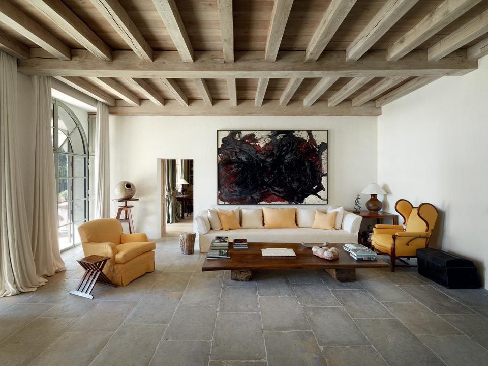 A painting by Vervoordt favorite Kazuo Shiraga presides over a sitting area in a private home.