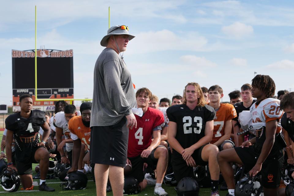 Hutto head coach Will Compton talks to the team after the Hippos' practice Monday. Compton takes over a Hutto program after serving as the offensive coordinator at Johnson.