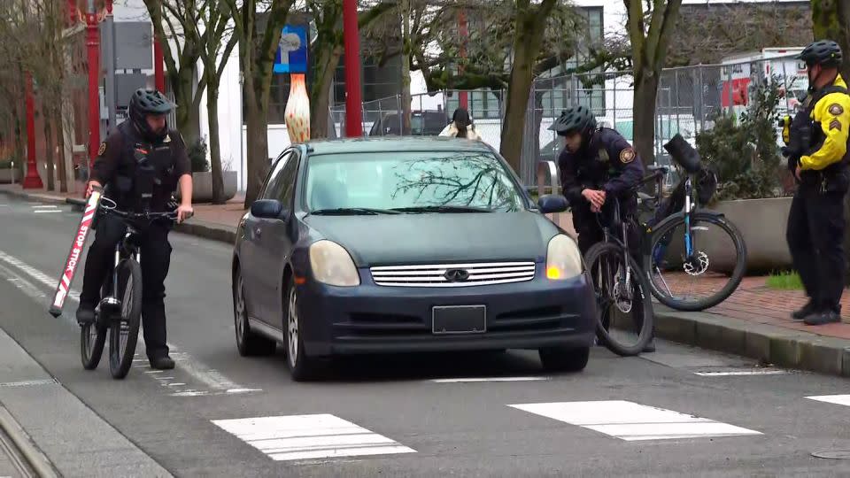Portland police Officers David Baer and Donny Mathew stop a vehicle without license plates near a street corner known to be frequented by fentanyl dealers. - CNN