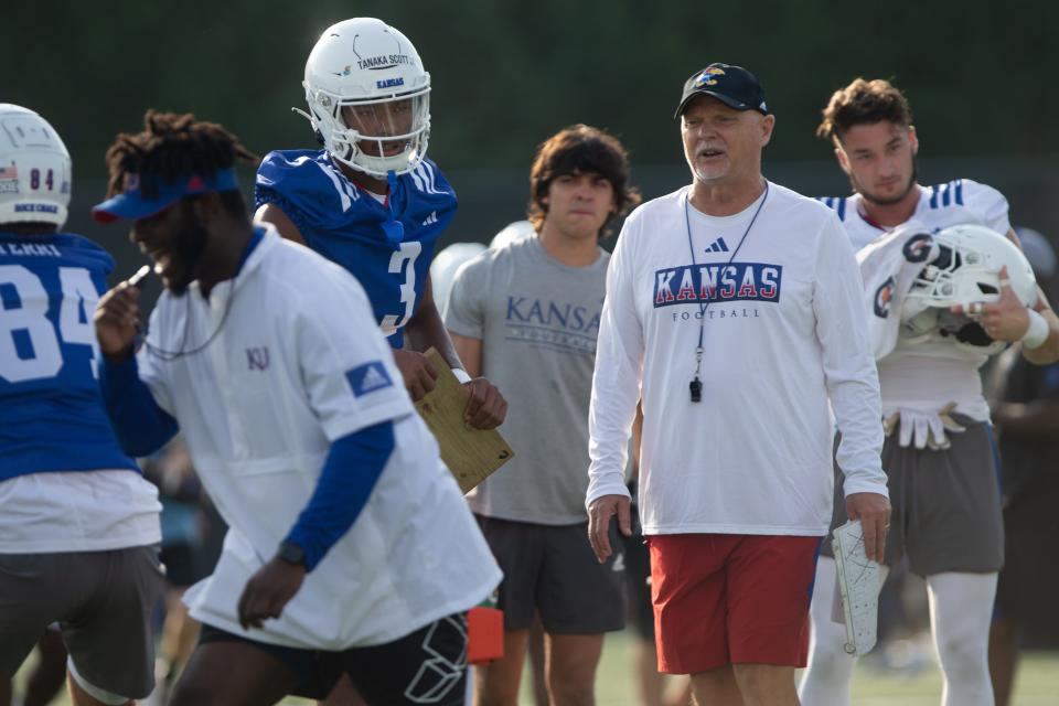 Kansas football defensive coordinator Brian Borland watches players run through a drill at a fall camp practice this year in Lawrence.