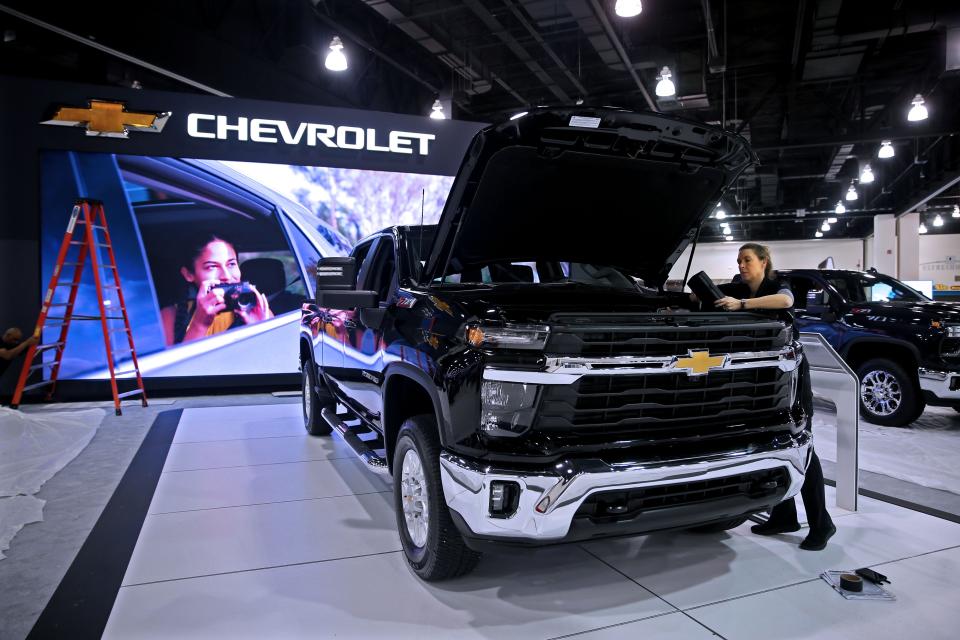 Jamie Makowski, product specialist for Chevrolet preps a Chevrolet Silverado HD 2023 for the 2023 Milwaukee Auto Show at the Wisconsin Center on Thursday, Feb. 23, 2023 at 400 W. Wisconsin Ave. The show runs Feb. 25 through March 5. The show features hundreds of new cars, trucks, crossovers, SUVs and all-electric vehicles. On view will also be pre-production vehicles, high-end luxury vehicles and restored classics. Show goers can also take in an 18-hole mini-indoor golf course and check out Subaru’s Pet Adoption area.