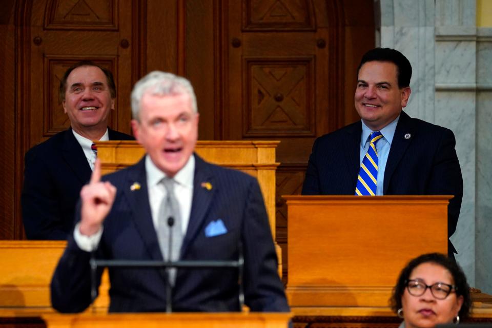 Assembly Speaker Craig Coughlin, far left, and Senate President Nick Scutari, far right, look on during Gov. Phil Murphy's budget address at the New Jersey Statehouse on Tuesday, Feb. 28, 2023.