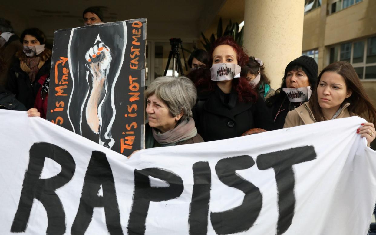 Activists take part in a demonstration, after a British woman was found guilty of faking a rape claim, outside the Famagusta courthouse in Paralimni - REUTERS