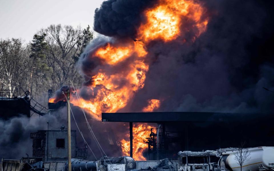 A fuel storage facility burns after Russian attacks in the city of Kalynivka, on March 25, 2022.  - Fadel Senna/AFP