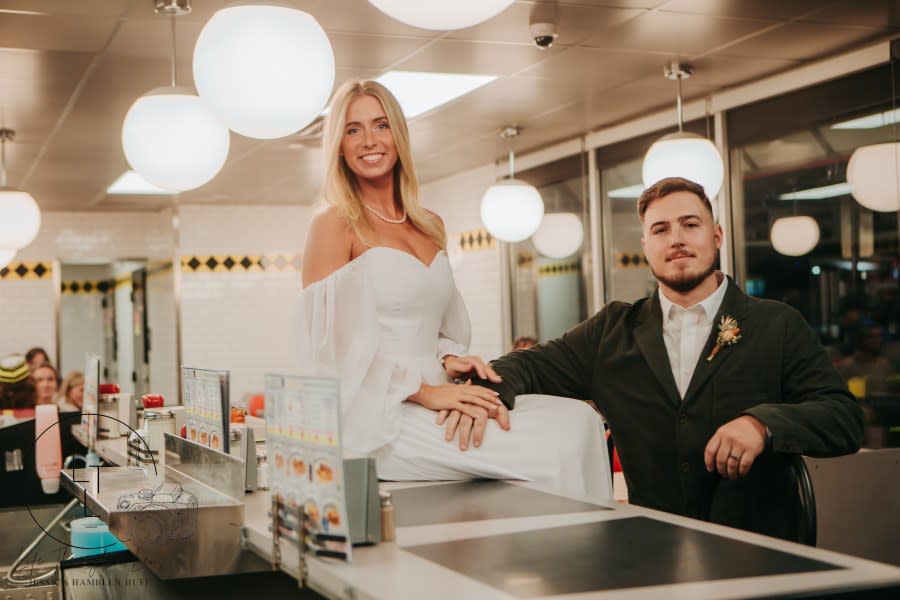 <em>Newlyweds Mary Cate and Eli Holbrook hold their wedding reception at a Waffle House in Lebanon, Tennessee. (Photo credit: Jessica Hamblen with Life Through a Lens provided to NewsNation.)</em>