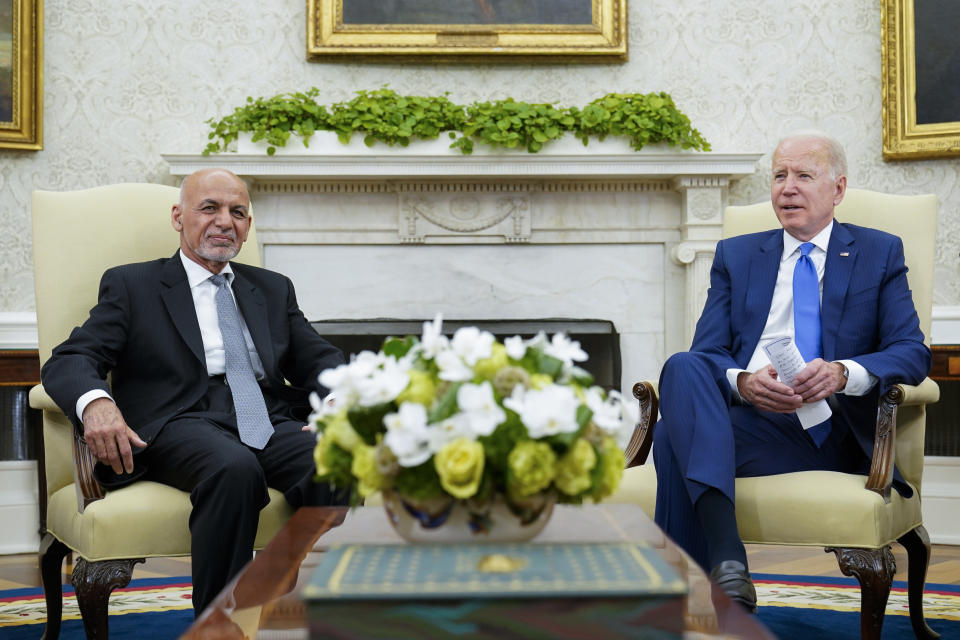 FILE - President Joe Biden, right, meets with Afghan President Ashraf Ghani, left, in the Oval Office of the White House in Washington, June 25, 2021. The deposed leader of Afghanistan was among the top gift givers to President Joe Biden and his family in 2021, according to federal documents published on Thursday, Feb. 23, 2023. Then-Afghan President Ghani and his wife gave the U.S. president and first lady Jill Biden silk rugs worth an estimated $28,800. (AP Photo/Susan Walsh, File)