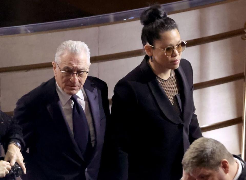 Robert De Niro and Tiffany Chen arrive for the Academy Awards.