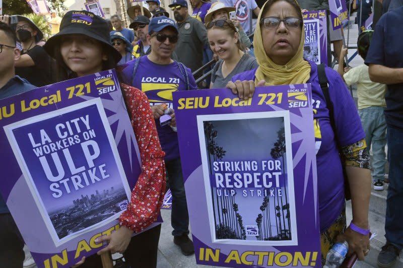 Los Angeles city workers rally at City Hall as thousands went on strike from downtown to Los Angeles Airport on Tuesday. Photo by Jim Ruymen/UPI