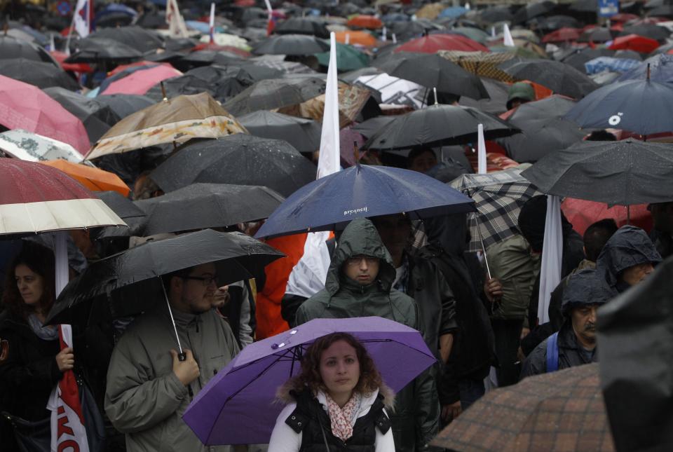 Protesters from the Communist-affiliated trade union PAME take part in a rally during a general 24 hour labour strike in Athens