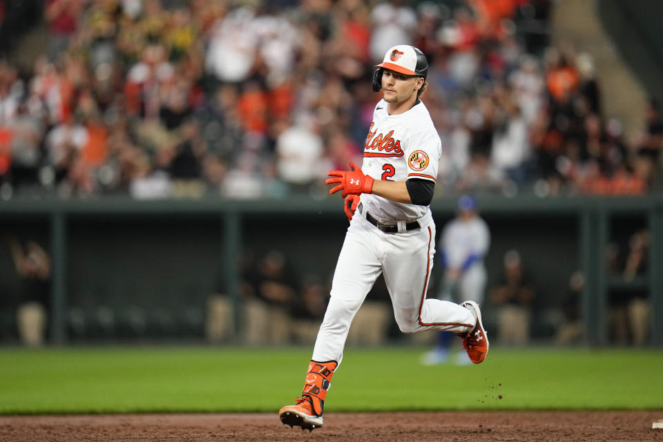 Baltimore Orioles' Gunnar Henderson runs the bases after hitting a grand slam home run off Toronto Blue Jays starting pitcher Chris Bassitt during the third inning of a baseball game, Tuesday, June 13, 2023, in Baltimore. Orioles' Aaron Hicks, Ramon Urias and Jorge Mateo scored on the home run. (AP Photo/Julio Cortez)