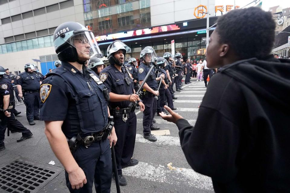 PHOTO: Police officers yell at people to move on the the sidewalk on Broadway as they try clear the crowd from the Union Square area, Aug. 4, 2023, in New York. (Mary Altaffer/AP)