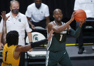 Michigan State's Joshua Langford, right, looks to pass against Oakland's Rashad Williams during the second half of an NCAA college basketball game, Sunday, Dec. 13, 2020, in East Lansing, Mich. (AP Photo/Al Goldis)