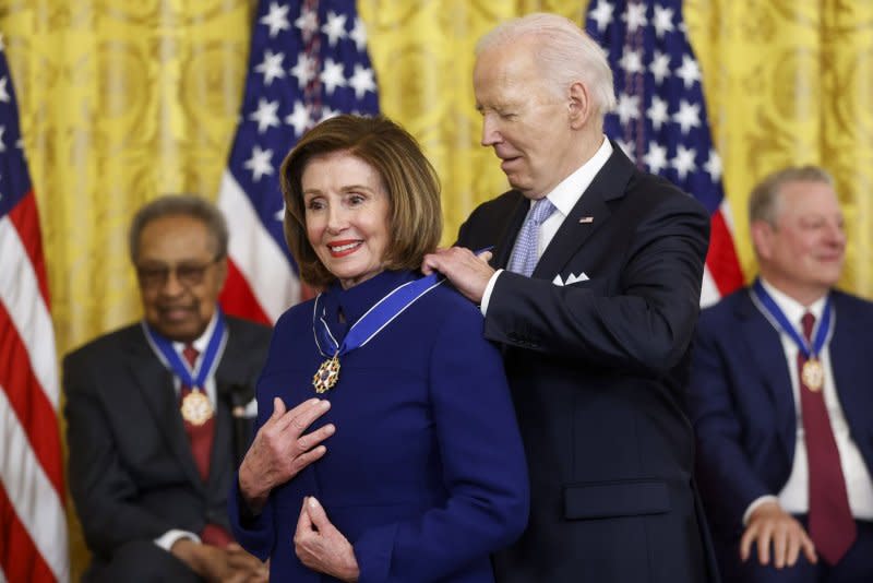 U.S. President Joe Biden presents former Speaker of the House Rep. Nancy Pelosi with the Presidential Medal of Freedom, the country's highest civilian honor, during a ceremony in the East Room of the White House in Washington, D.C., on Friday. Photo by Jonathan Ernst/UPI