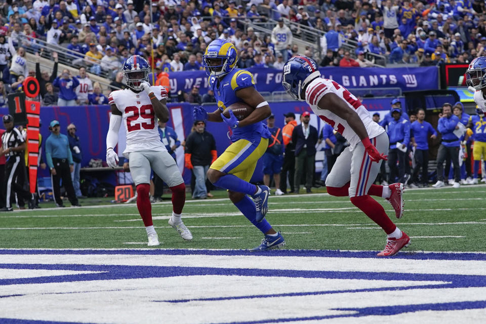 Los Angeles Rams' Robert Woods, center, scores a touchdown during the first half of an NFL football game against the Los Angeles Rams, Sunday, Oct. 17, 2021, in East Rutherford, N.J. (AP Photo/Frank Franklin II)