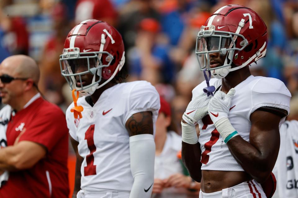 Sep 18, 2021; Gainesville, Florida, USA; Alabama Crimson Tide wide receivers Ja'Corey Brooks (7) and Jameson Williams (1) look on prior to a game at Ben Hill Griffin Stadium. Mandatory Credit: Kim Klement-USA TODAY Sports