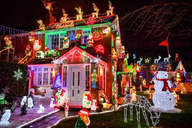 The house features more than 50,000 Christmas lights (Ben Birchall/PA)