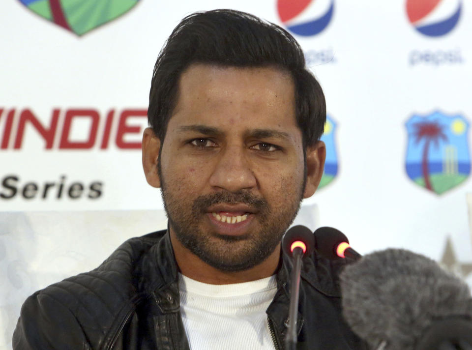 Pakistan's banned captain Sarfraz Ahmed listens to a reporter during a press conference in Karachi, Pakistan, Sunday, Feb. 3, 2019. Ahmed hopes his four-match suspension will not deny him from leading the country in the World Cup in England later this year. (AP Photo/Fareed Khan)