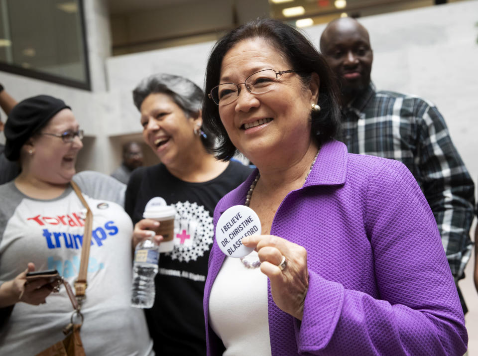 <p> Sen. Mazie Hirono, D-Hawaii, a member of the Senate Judiciary Committee, is welcomed by protesters opposed to President Donald Trump's Supreme Court nominee, Brett Kavanaugh, as they demonstrate in the Hart Senate Office Building on Capitol Hill in Washington, Thursday, Sept. 20, 2018. Kavanaugh has denied stories of a sexual assault as alleged by California college professor Christine Blasey Ford. (AP Photo/J. Scott Applewhite) </p>