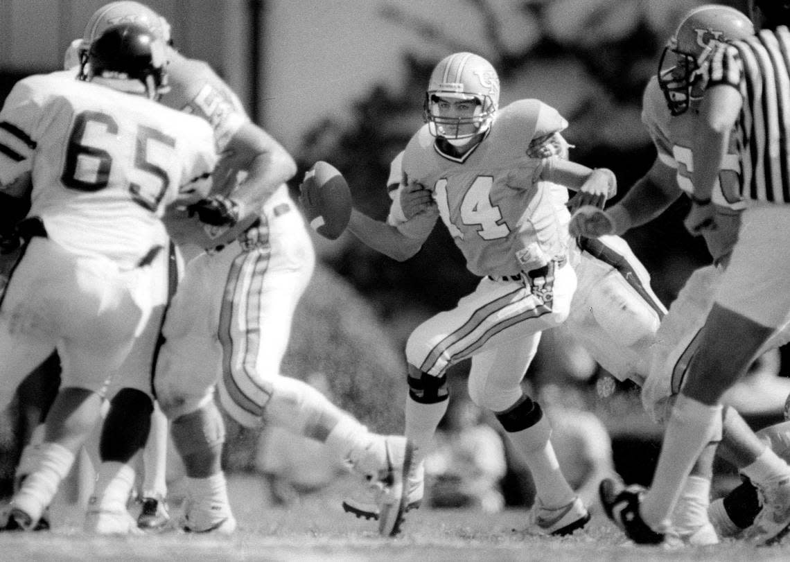 North Carolina quarterback Mark Maye (14) runs the ball against Wake Forest on October 10, 1987 at Kenan Stadium in Chapel Hill, N.C.