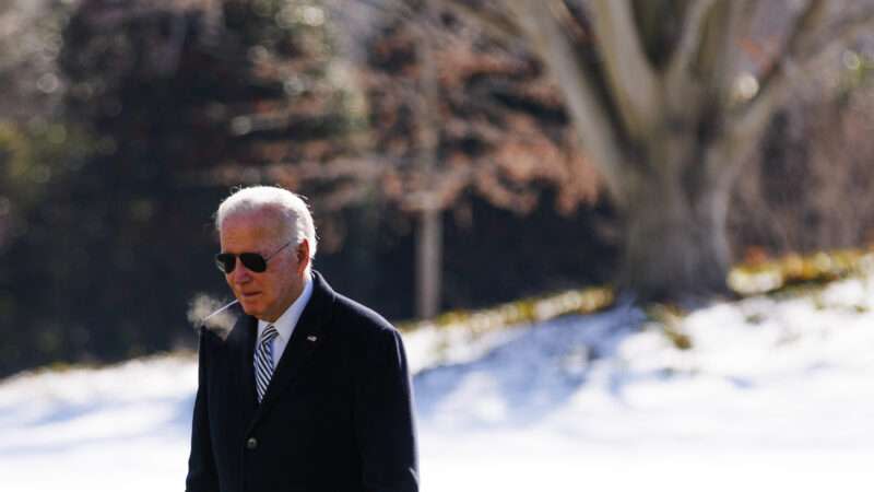 President Joe Biden walking outdoors